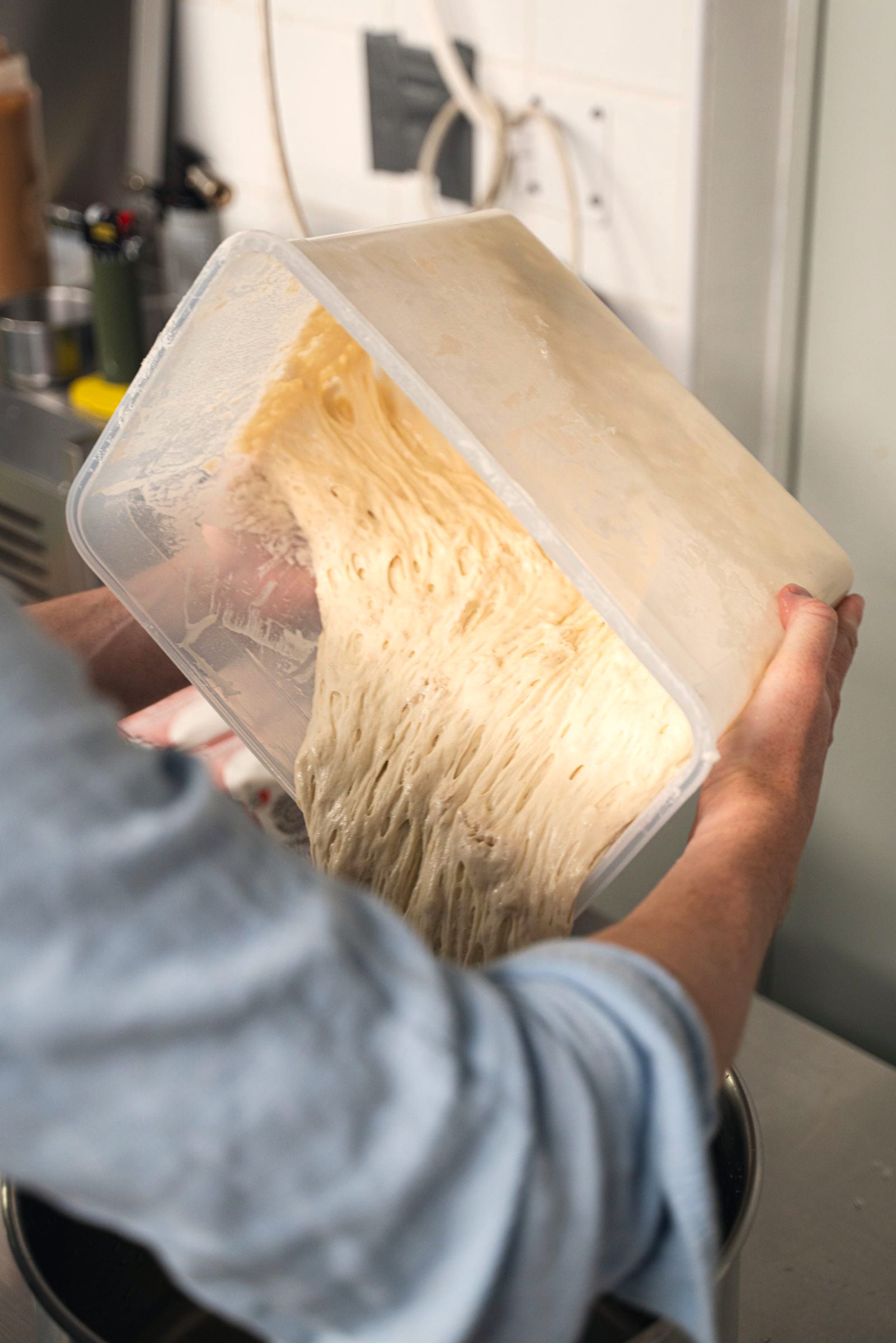 House sourdough being shaped in the Café 1070 kitchen — baked five times a week from an 87-year-old starter
